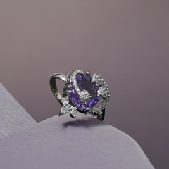 Luxurious Purple Amethyst Ring Surrounded by Silver Stones